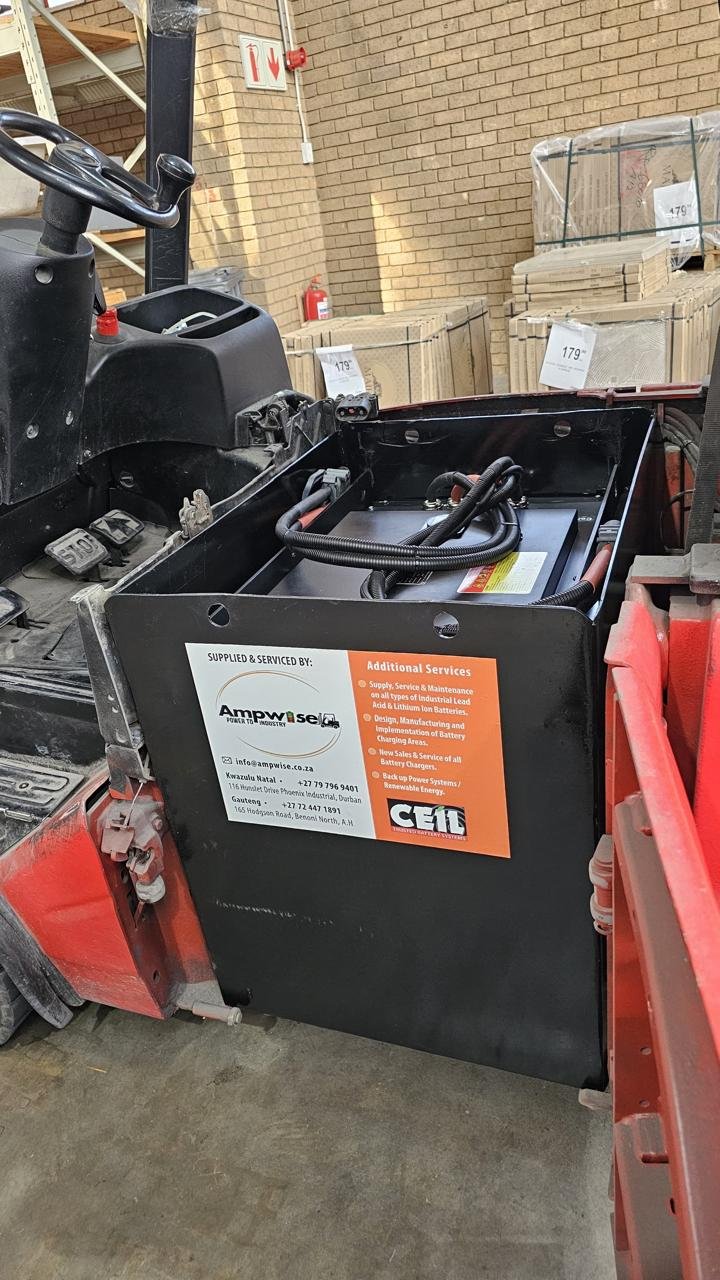 Lithium-ion battery conversion fitted into a forklift's battery compartment, supplied and serviced by Ampwise.